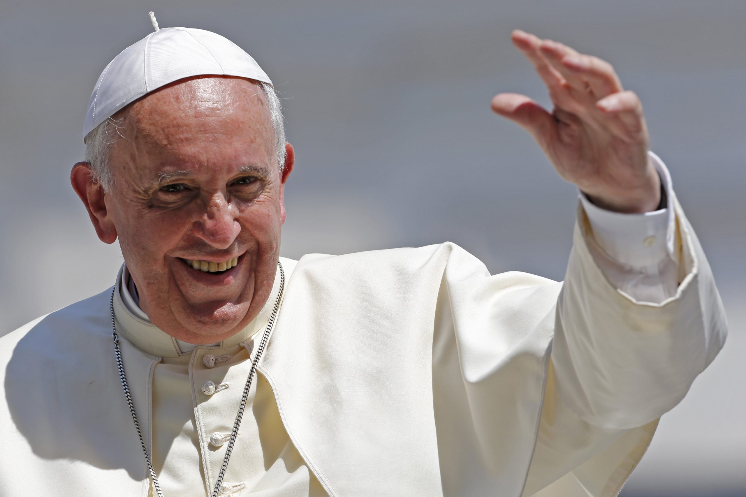 Pope francis waves after leading his weekly general audience at st. peter's square at the vatican